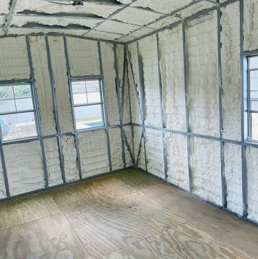 Closed-cell spray foam insulation applied to wall cavities in a residential project in Rockaway